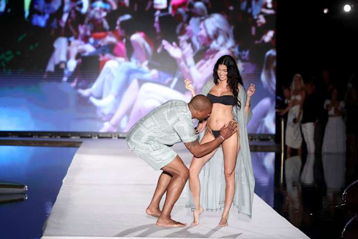 Larry English and Nicole Williams English walk the runway for Sports Illustrated Swimsuit runway show during Paraiso Miami Beach.